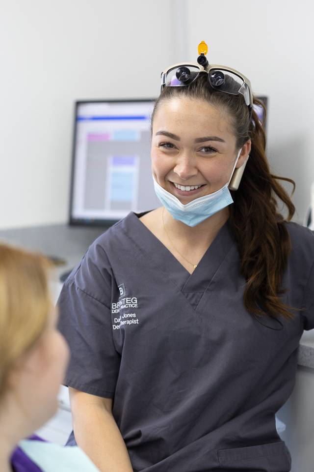 Clinician discussing tooth whitening with patient