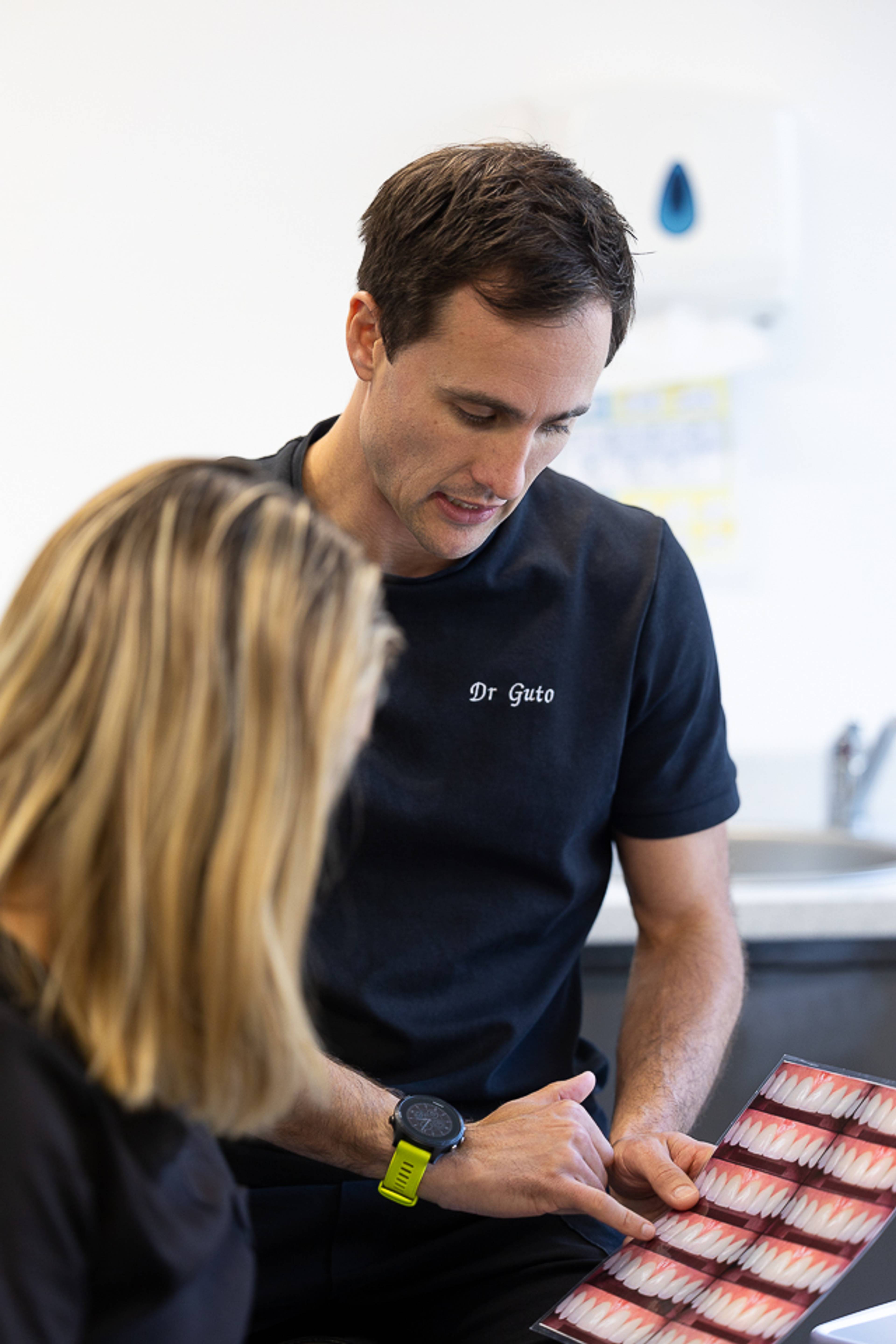 Dentist and patient discussing aligner treatment