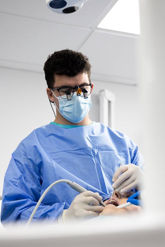 Dentist performing procedure
