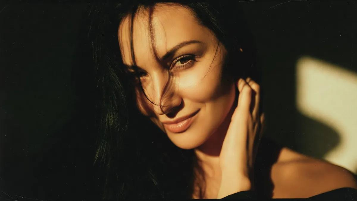 Woman with mysterious expression in dramatic lighting