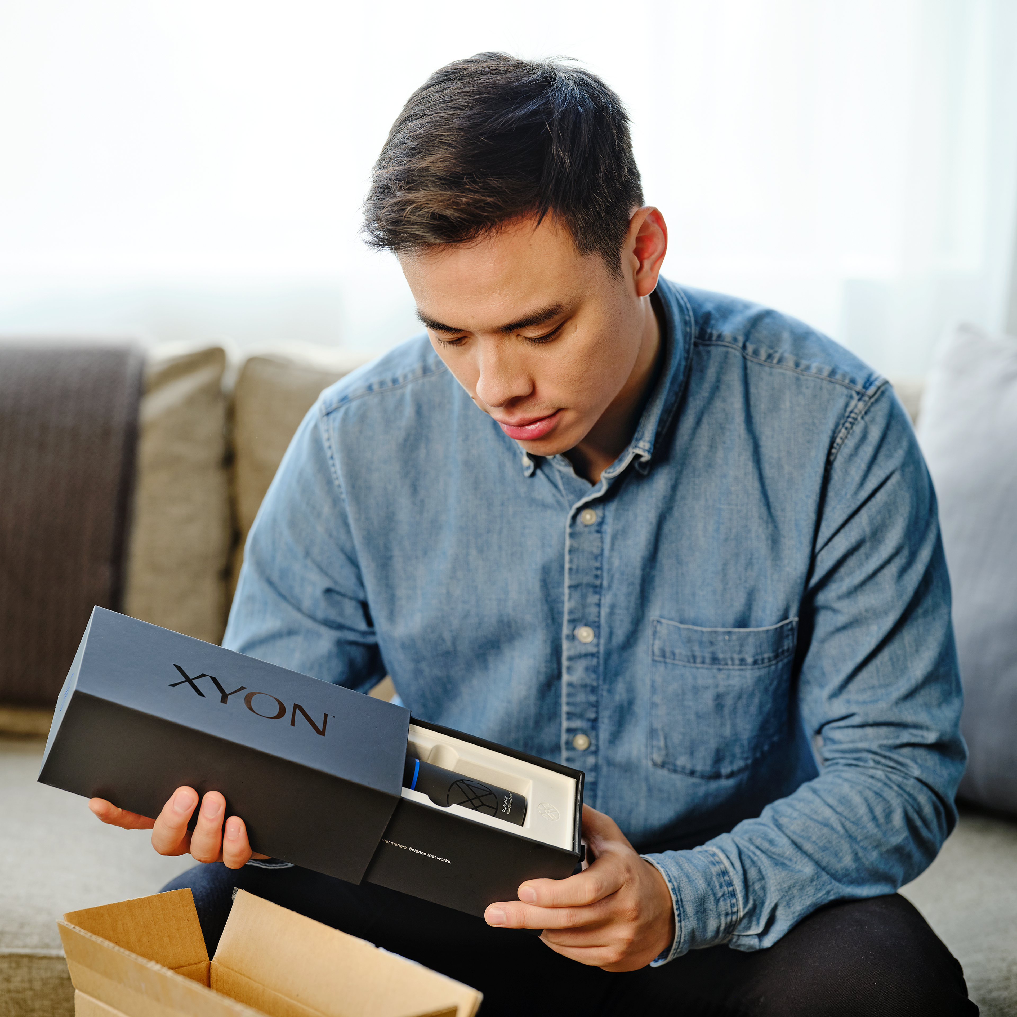 Man opening package of products