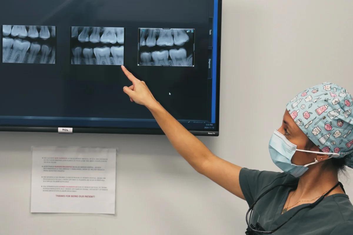 Hygienist points to an X-ray