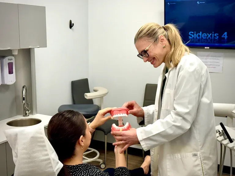 Dr.Alena is working with a patient in the office