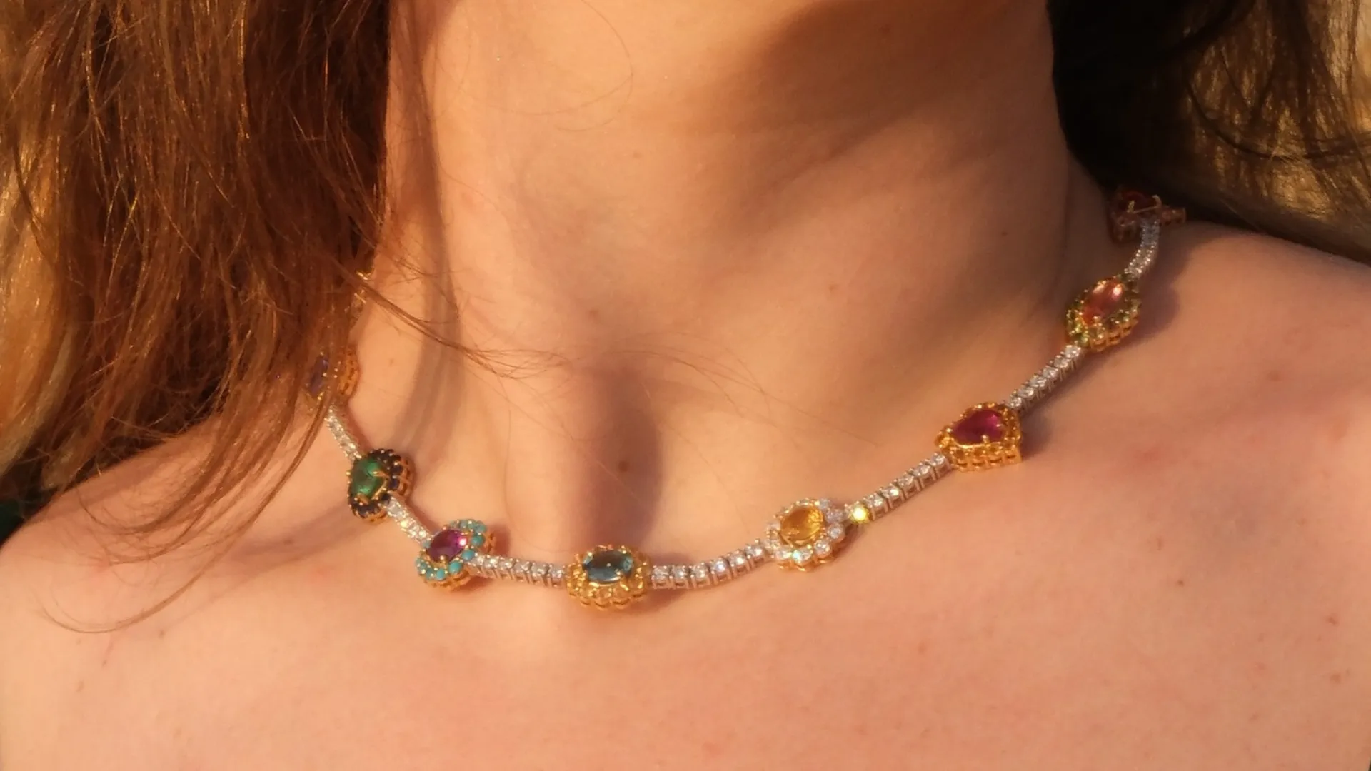A diamond rivière necklace by LM Gems, worn in warm natural light