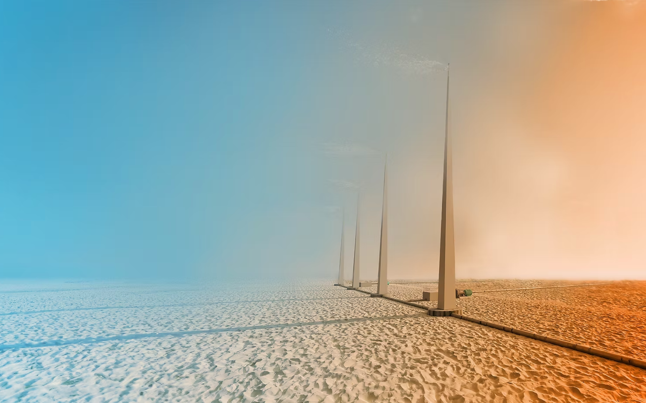 Desert landscape with futuristic structures under a shifting sky — an atmospheric visual echoing AtmoCooling’s mission to enable farming in arid regions through climate-adaptive technologies.