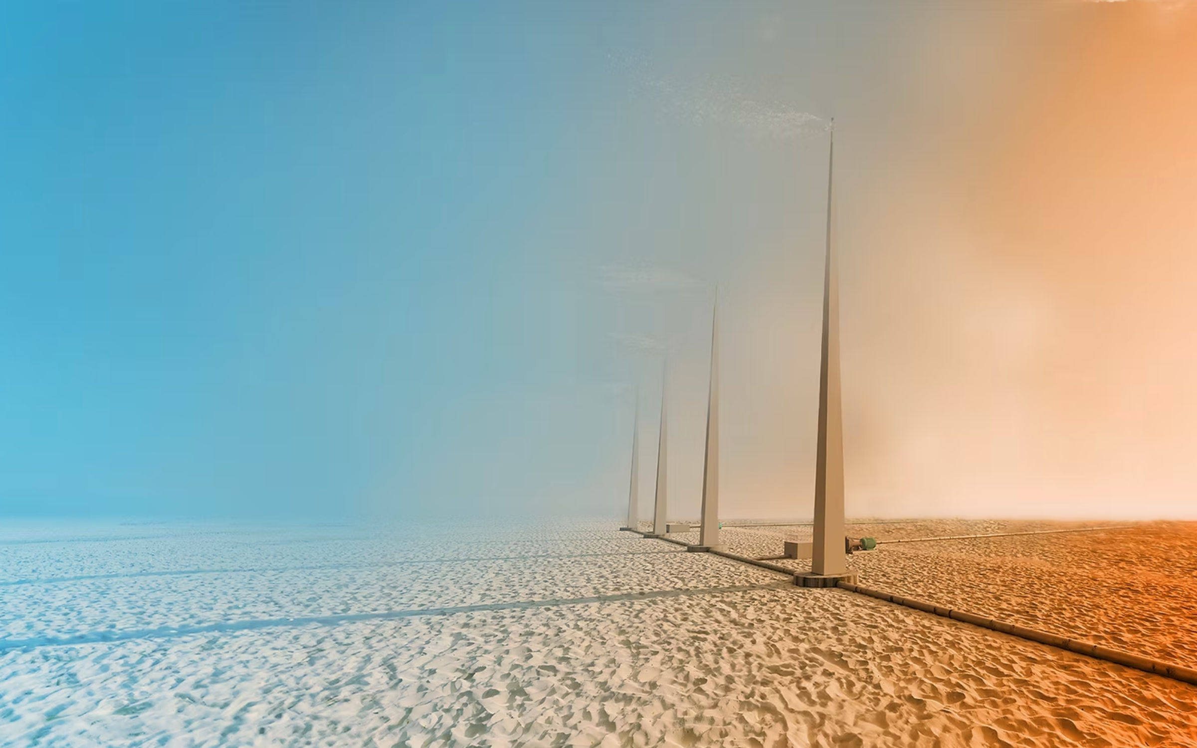 Desert landscape with futuristic structures under a shifting sky — an atmospheric visual echoing AtmoCooling’s mission to enable farming in arid regions through climate-adaptive technologies.