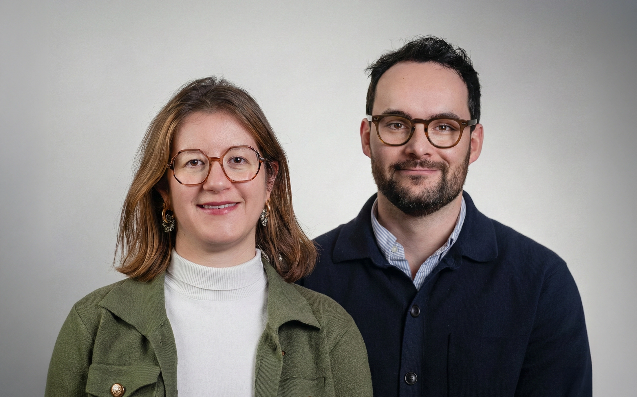 Close-up view of coiled copper wire with rich metallic tones and dramatic lighting, highlighting the texture and curvature of the metal.