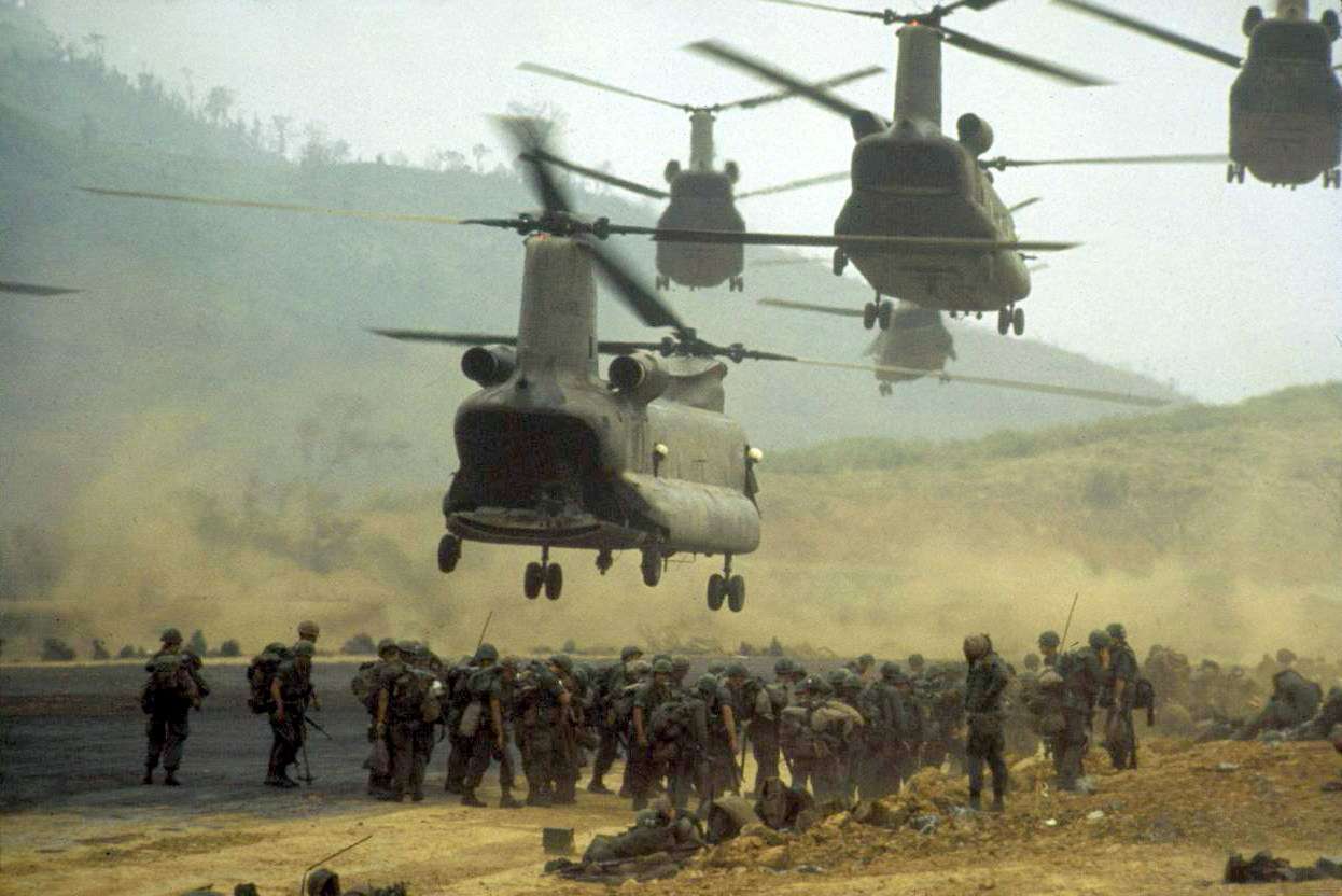 U.S. helicopter hovering over troops during the Vietnam War