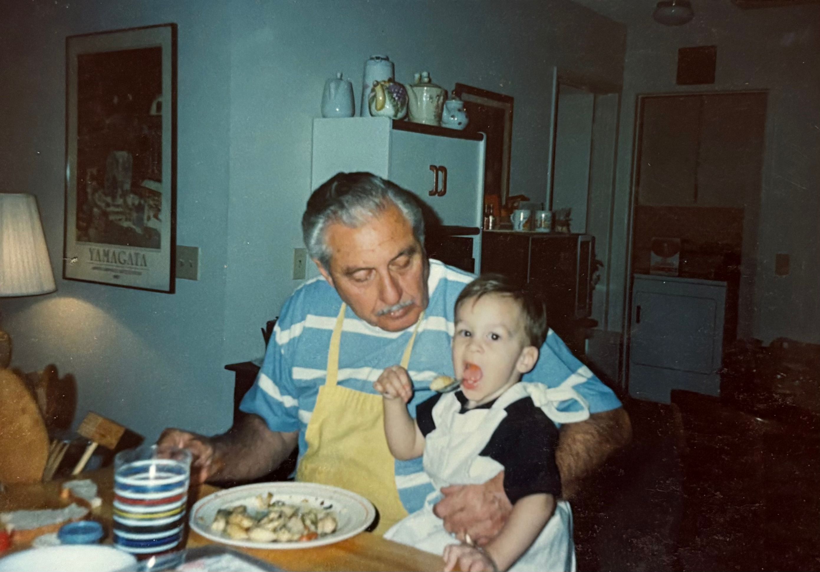 Sal holding a young Nic — a tender moment from a man who lived a hard life