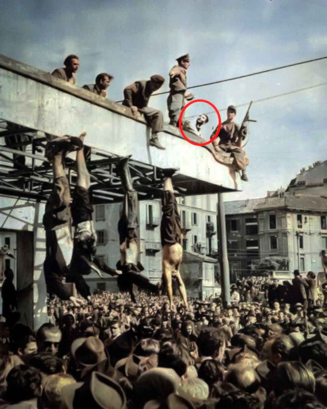 The public hanging of Mussolini at Piazzale Loreto, Milan — Sal can be seen in the background
