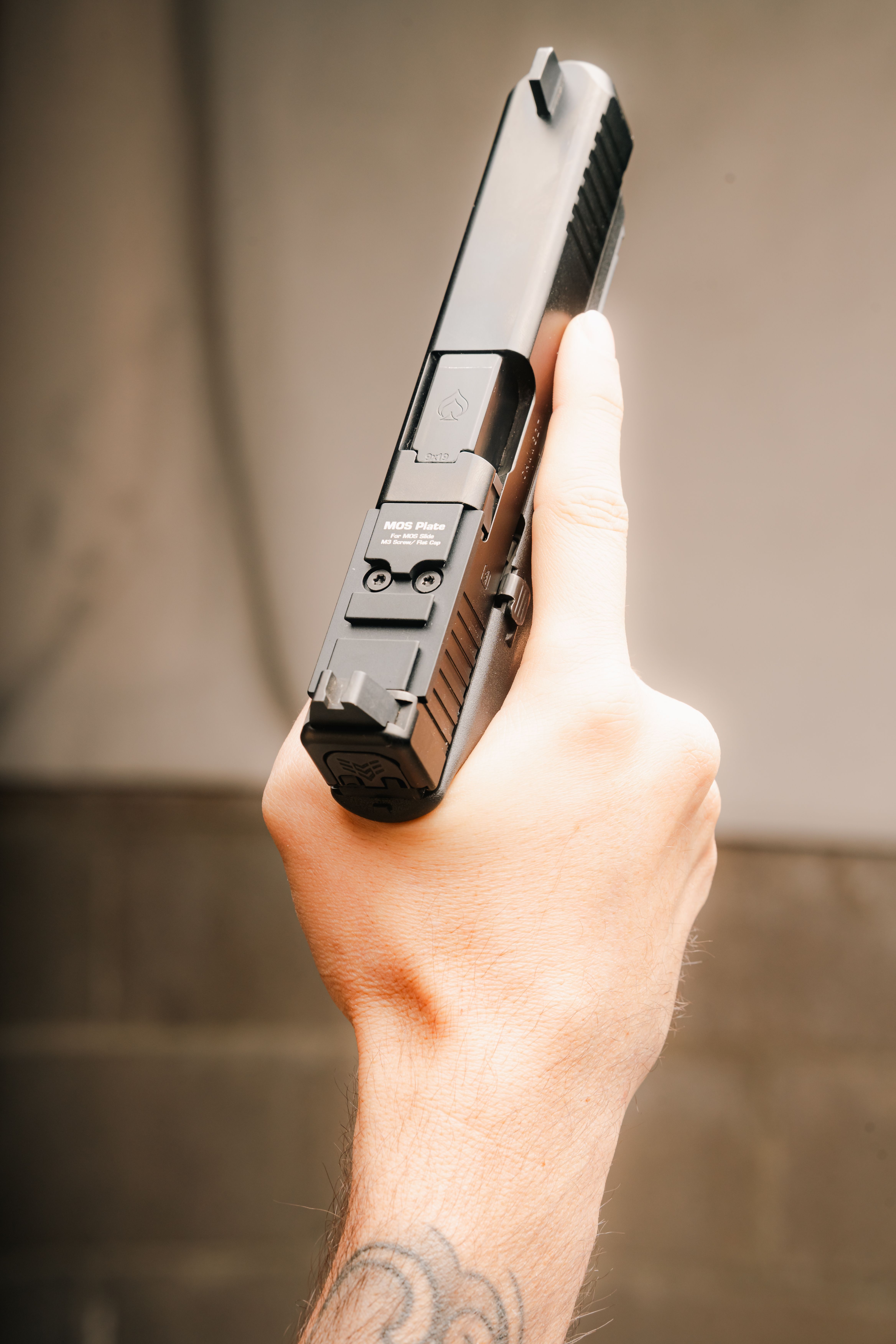 MOS adapter plate on a Glock slide without an optic installed