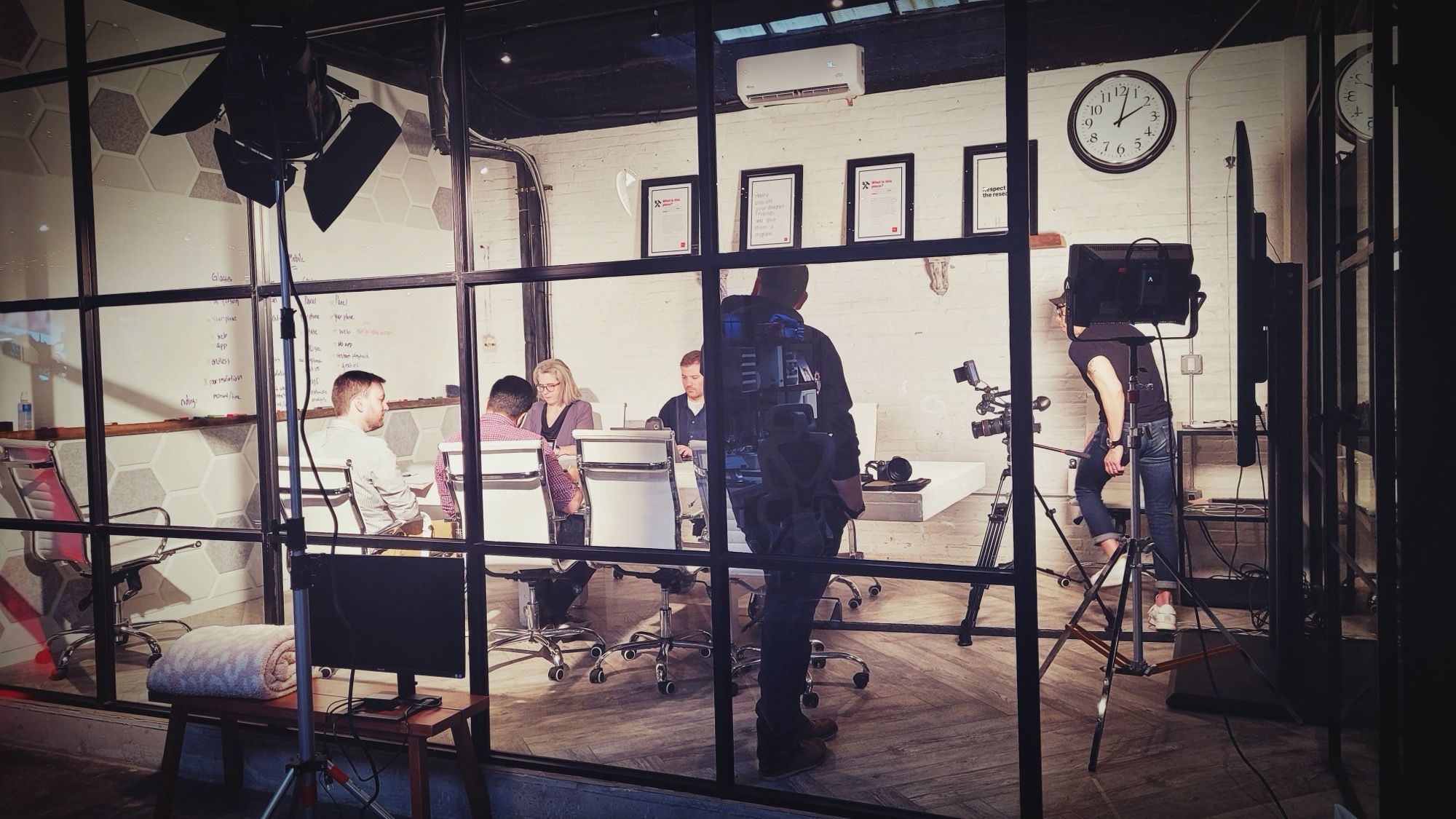 Filming in the glass conference room