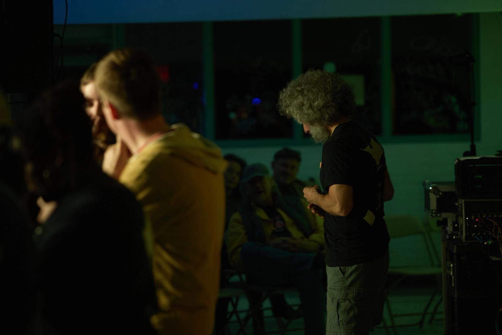 Mid-show ensemble interaction with multiple performers in the frame.