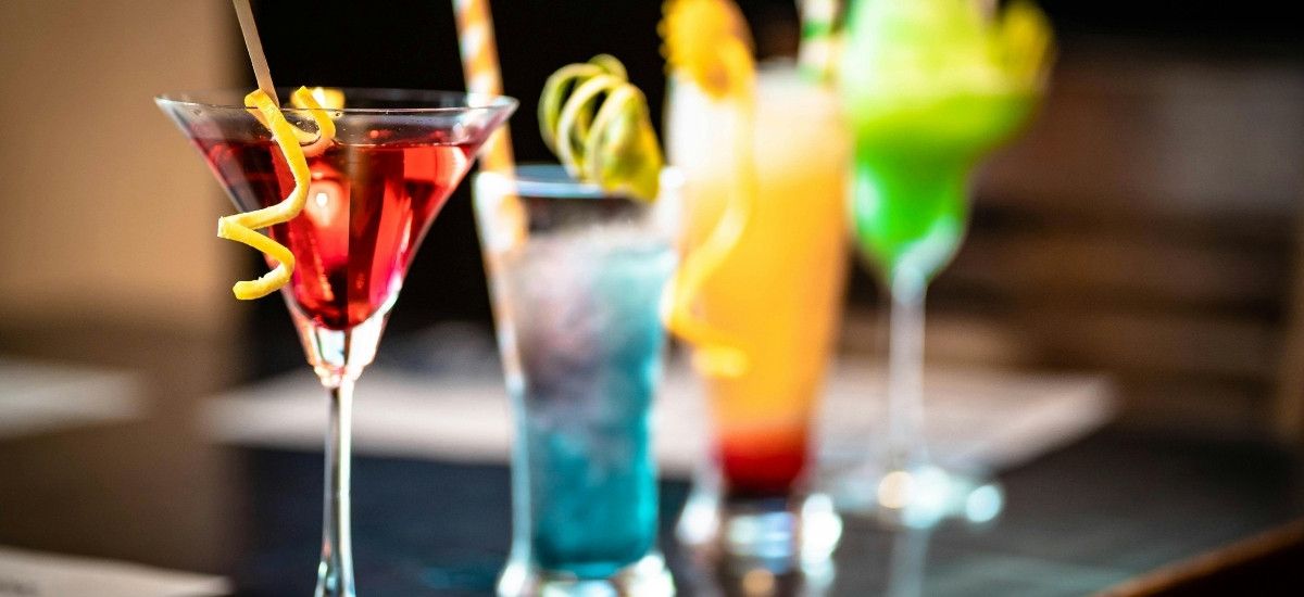 cocktails made from vodka lined up on the bar