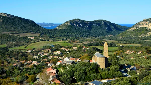 the island of corsica and a small town on the sea