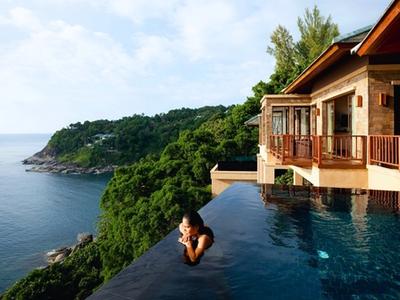 beautiful hotel cliffside in thailand with a pool and a luxury villa