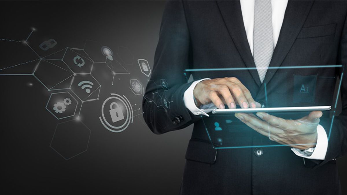 shared services, man holding a laptop, high tech