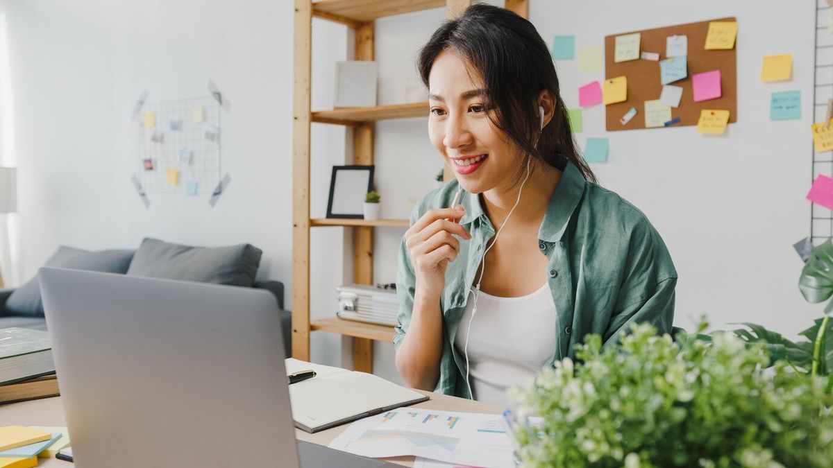 woman in casual clothes having a call on the laptop
