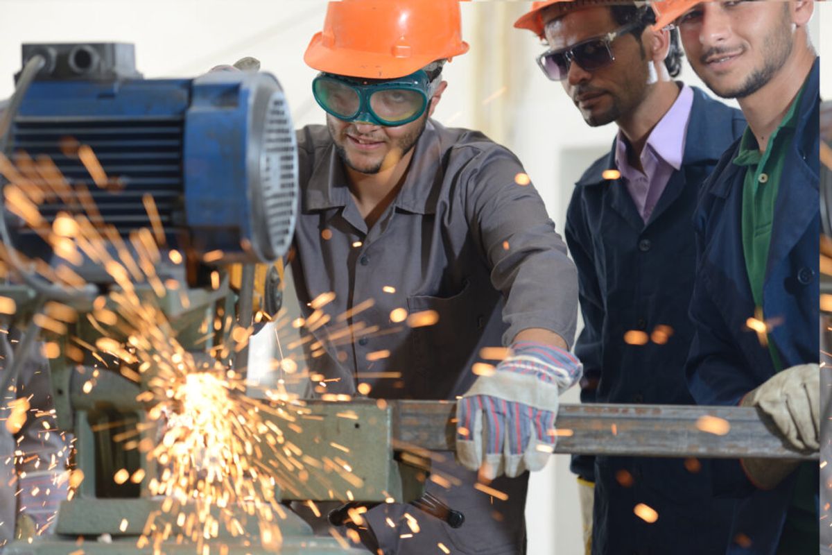 industries affected by recession, men in manufacturing company working