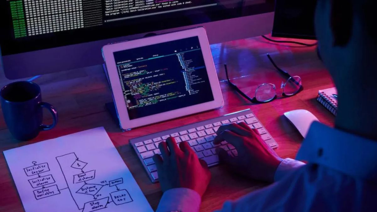 web developer coding on tablet
