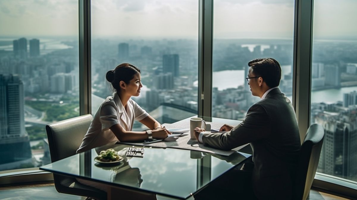 A dynamic image of a Filipino outsourcing provider discussing the rate card with a Filipino business owner.