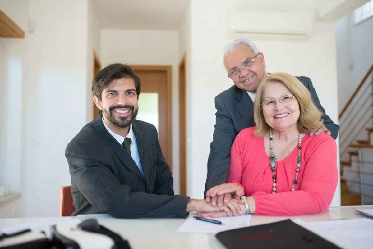 salesperson with two senior clients