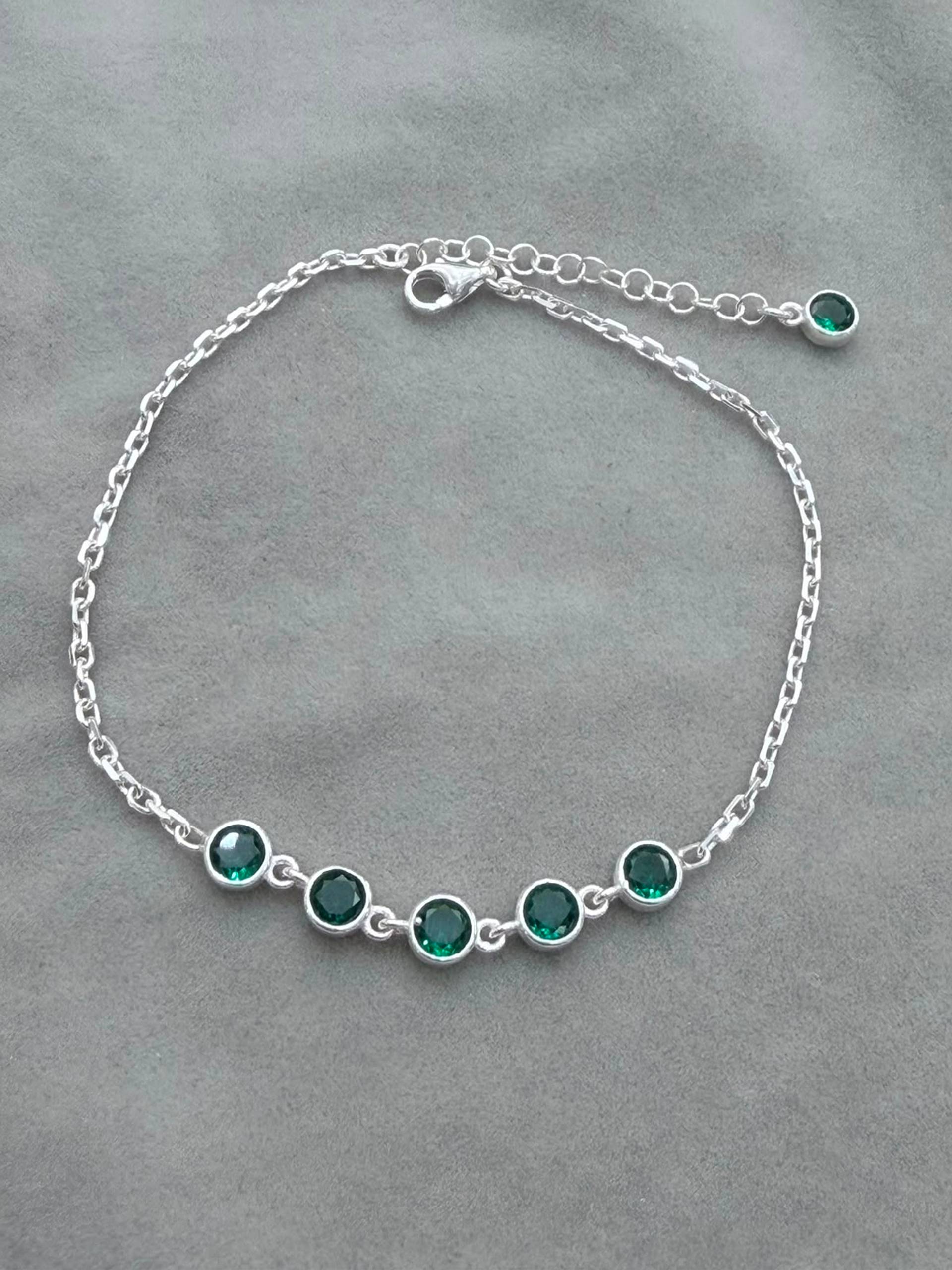 Pulsera  con centro eslabones circulares tono Esmeralda