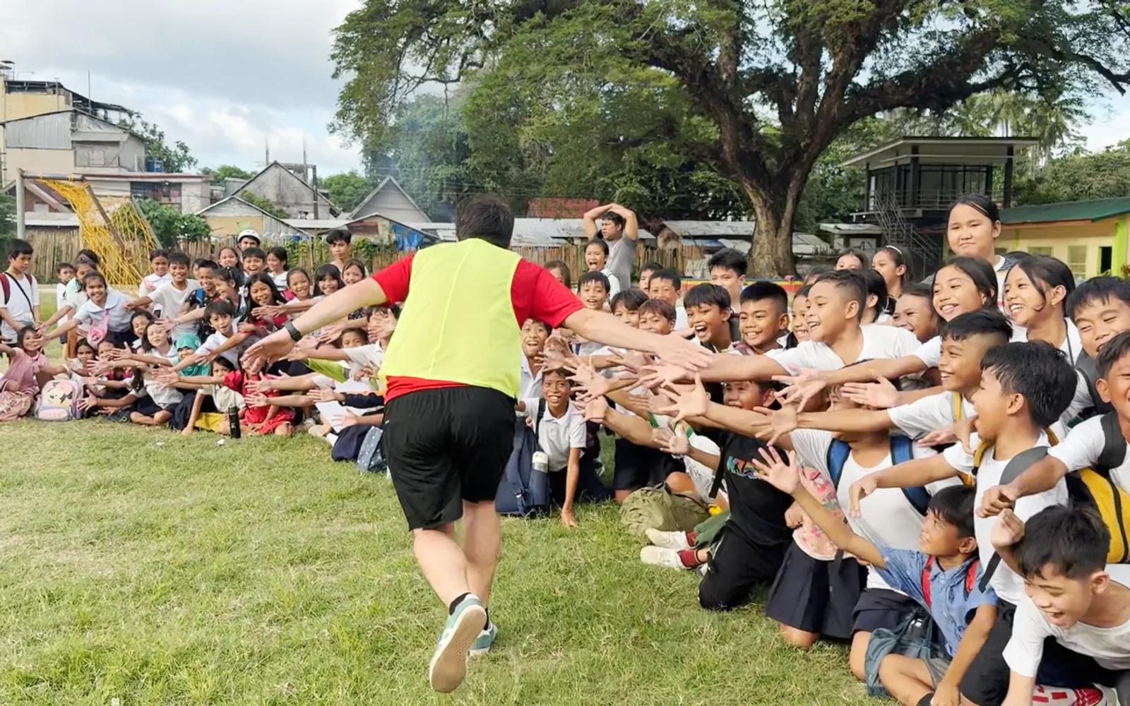 High-fives after a show in the Philippines