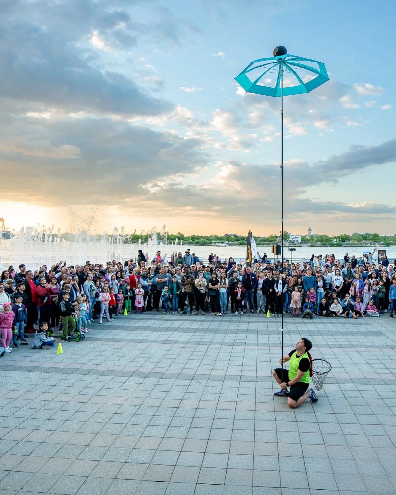 Stefan Florescu balancing an umbrella at a festival