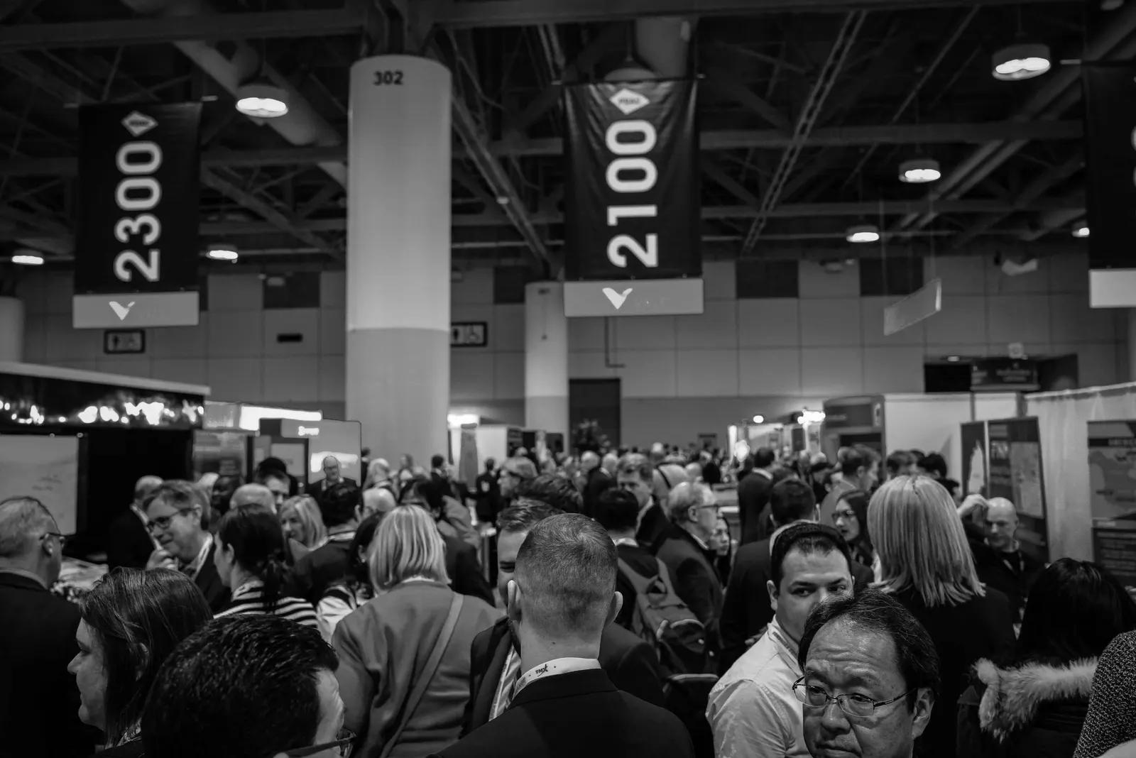 Packed conference floor in black and white