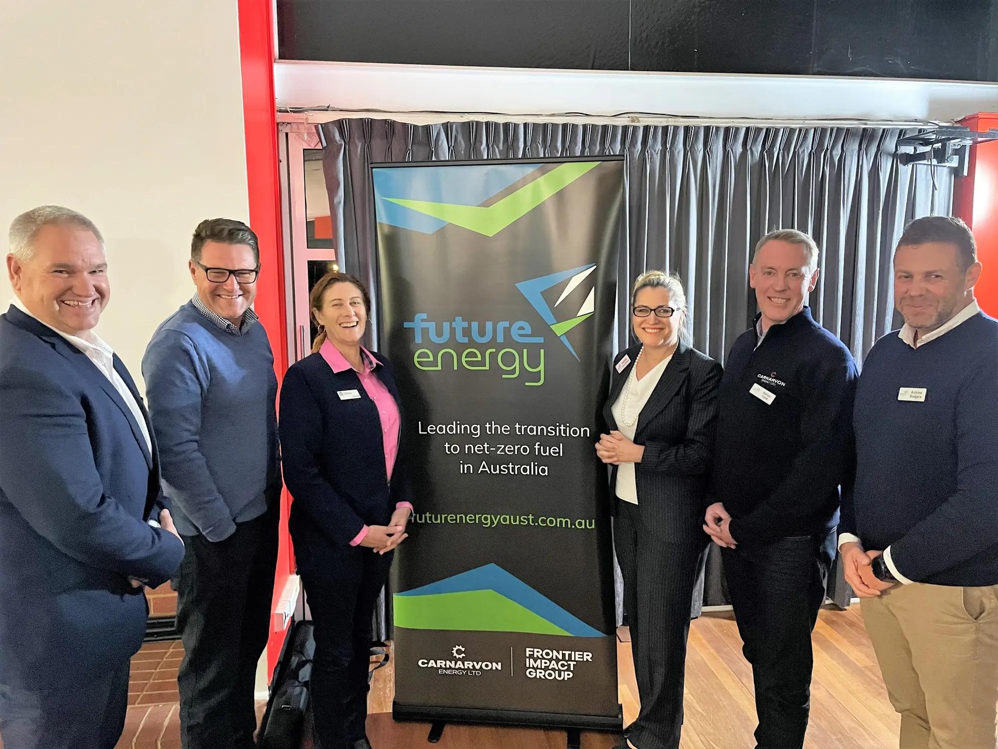 The FutureEnergy Australia team beside their banner at a community briefing.
