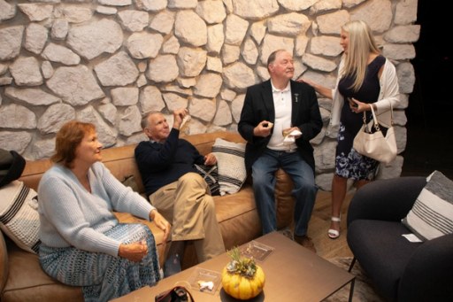 Attendees browsing the tasting tables at Sip, Savor, & Salute