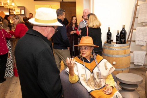 Guests posing together at the Sip, Savor, & Salute fundraiser