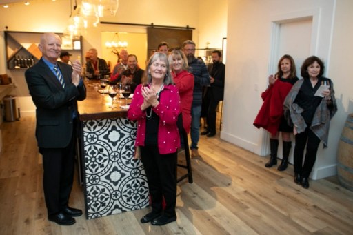Guests mingling at the Sip, Savor, & Salute fundraiser at Twisted Roots Winery