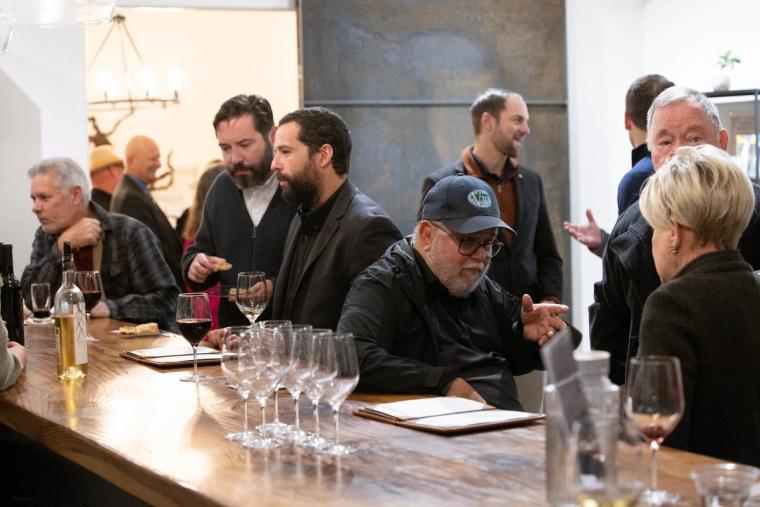 Guests seated at a table during the Sip, Savor, & Salute fundraiser