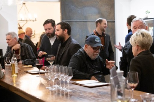 Guests seated at a table during the Sip, Savor, & Salute fundraiser