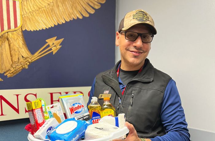 A Veteran holding a VTC welcome basket