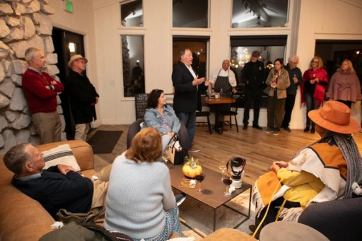 Guests mingling at the Sip, Savor, & Salute fundraiser at Twisted Roots Winery