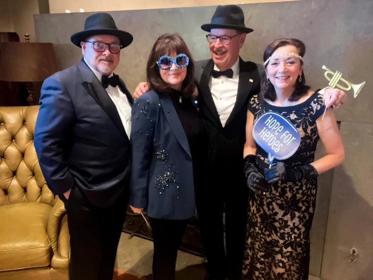 Guests raising a toast at the 2024 Hope for Heroes Gala