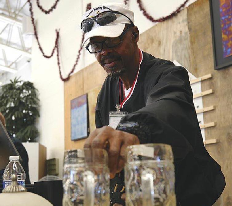 A Veteran working behind the counter at Last Chance Mercantile