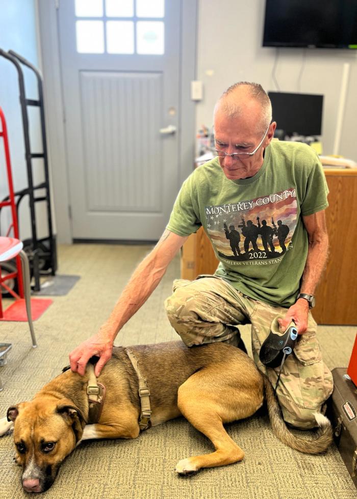 Kevin, a VTC graduate, with his dog Bandit