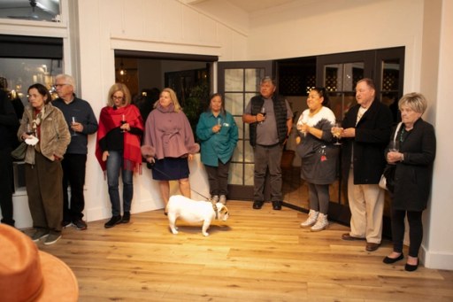 A candid moment among guests at Twisted Roots Winery during Sip, Savor, & Salute
