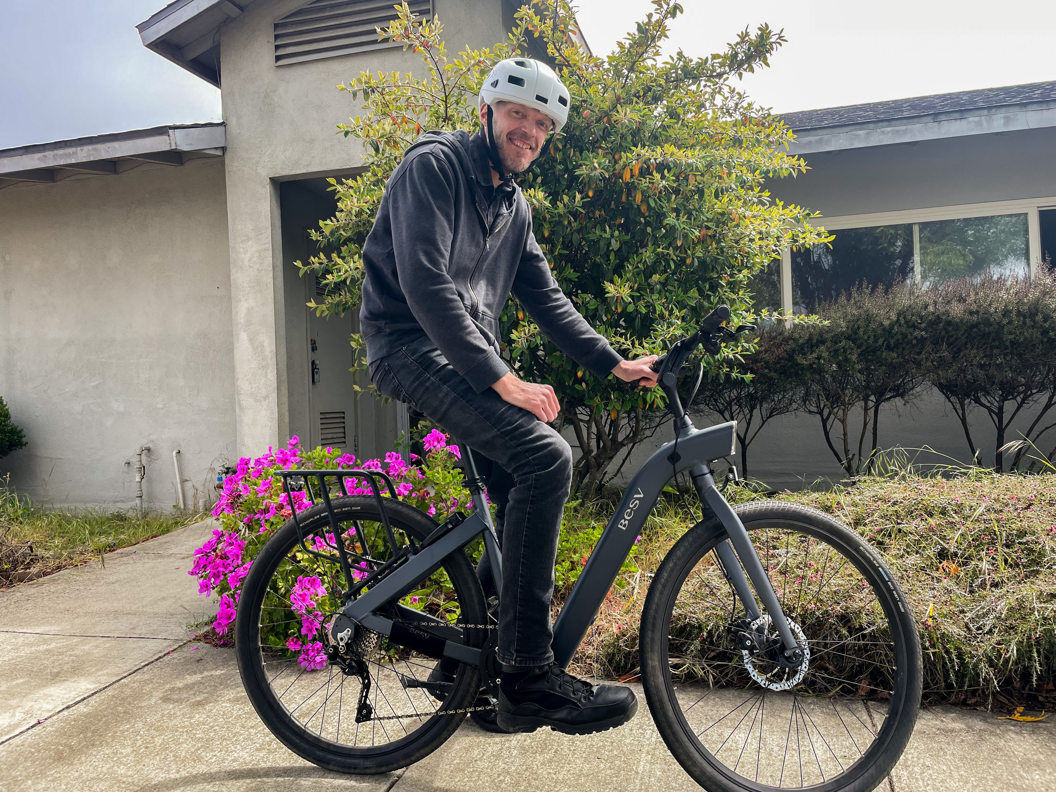 A VTC graduate with the e-bike that carries him to work