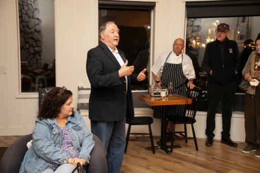Guests raising a toast at the Sip, Savor, & Salute Veterans Day weekend fundraiser