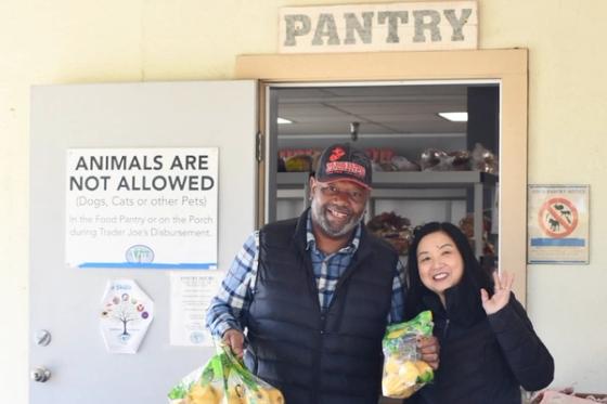 A Veteran and volunteer with fresh groceries at the VTC food pantry