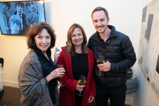 Guests gathered under the string lights at Sip, Savor, & Salute