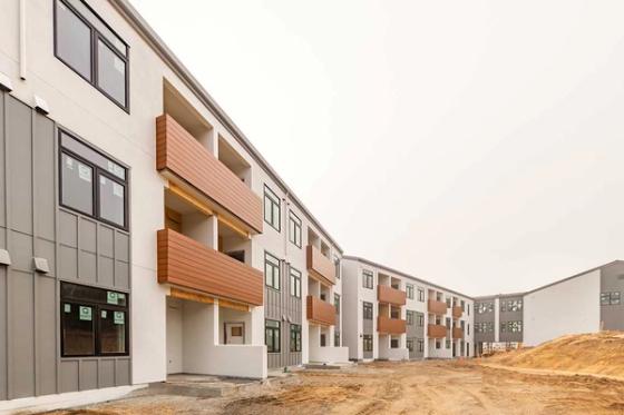 The Lightfighter Village permanent supportive housing community, a row of modern apartment buildings on VTC's Fort Ord campus