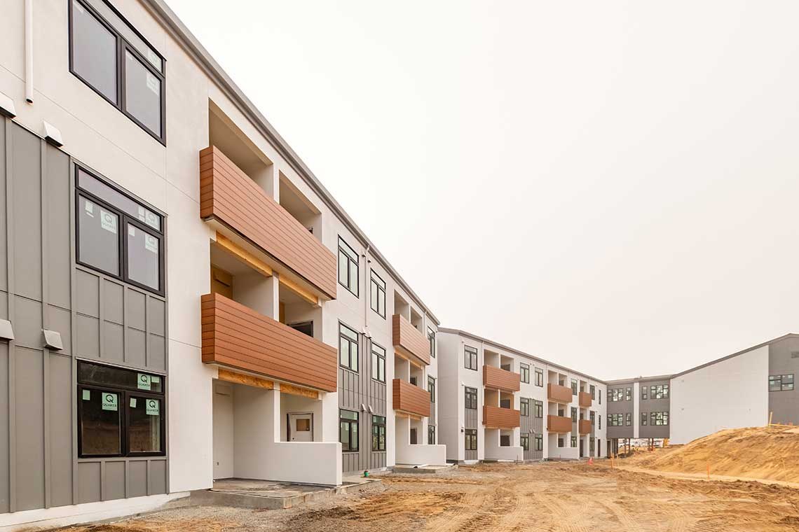 The Lightfighter Village permanent supportive housing community, a row of modern apartment buildings on VTC's Fort Ord campus