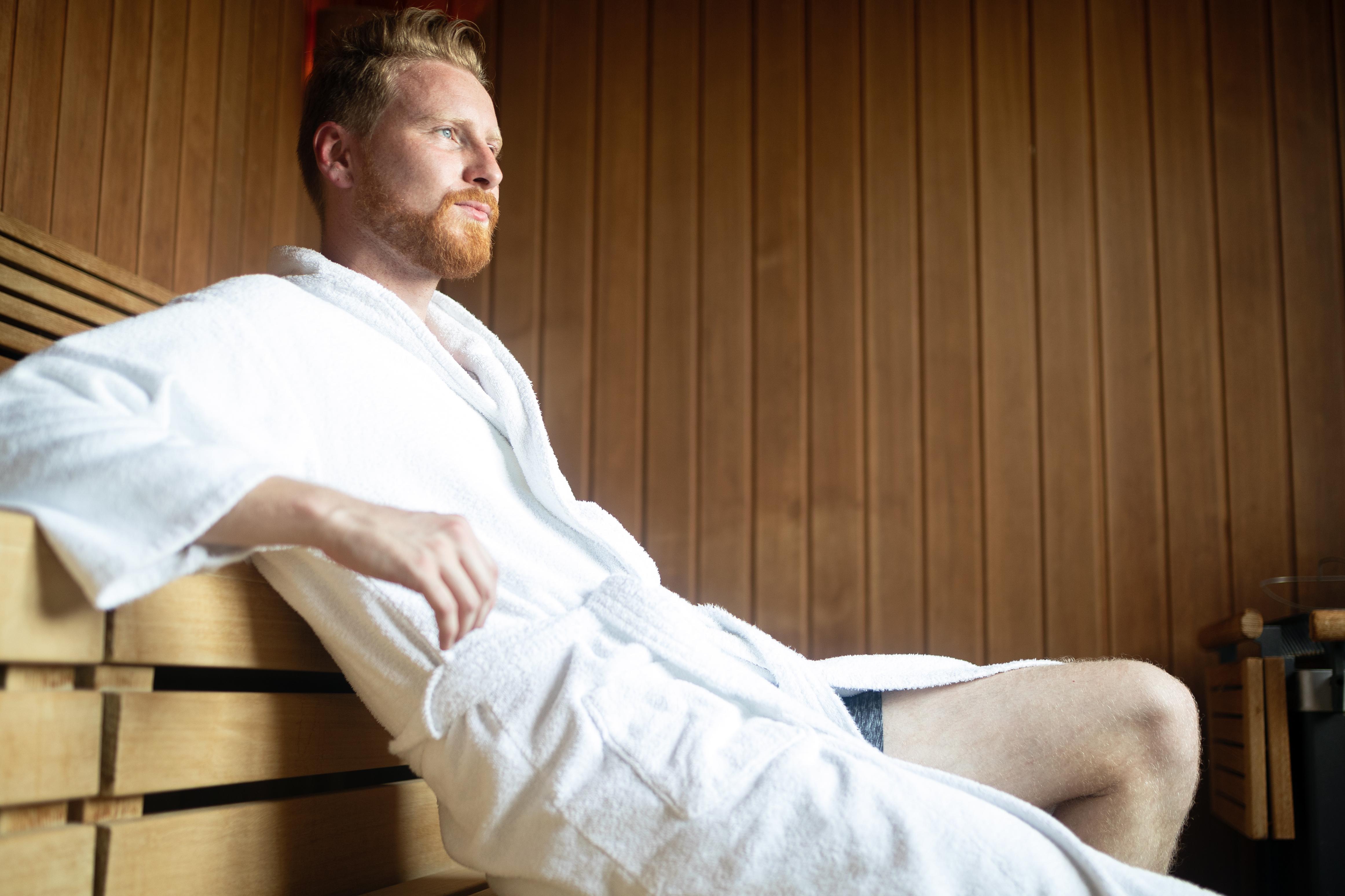A man enjoying the heat in a sauna