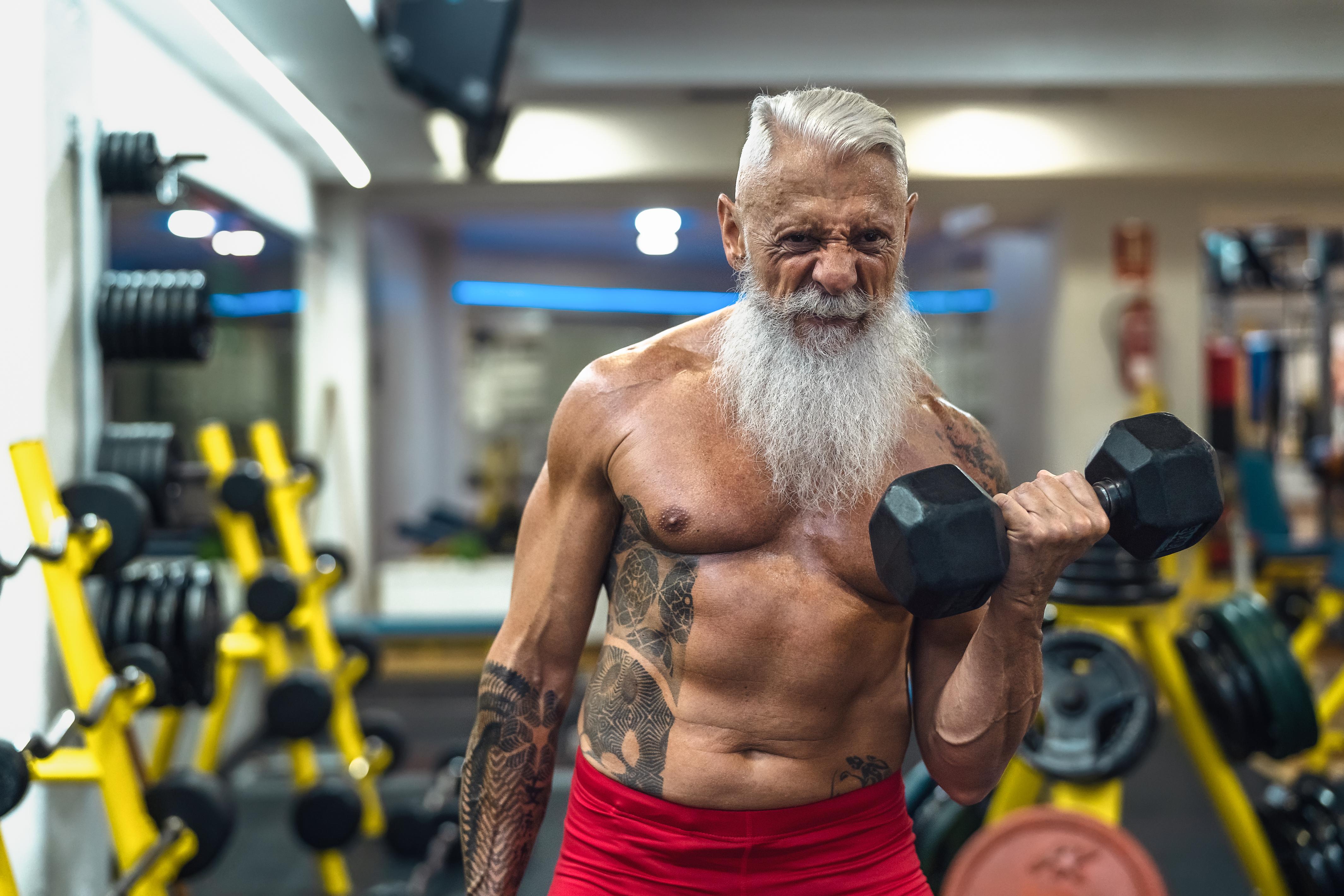 A muscular old man at the gym